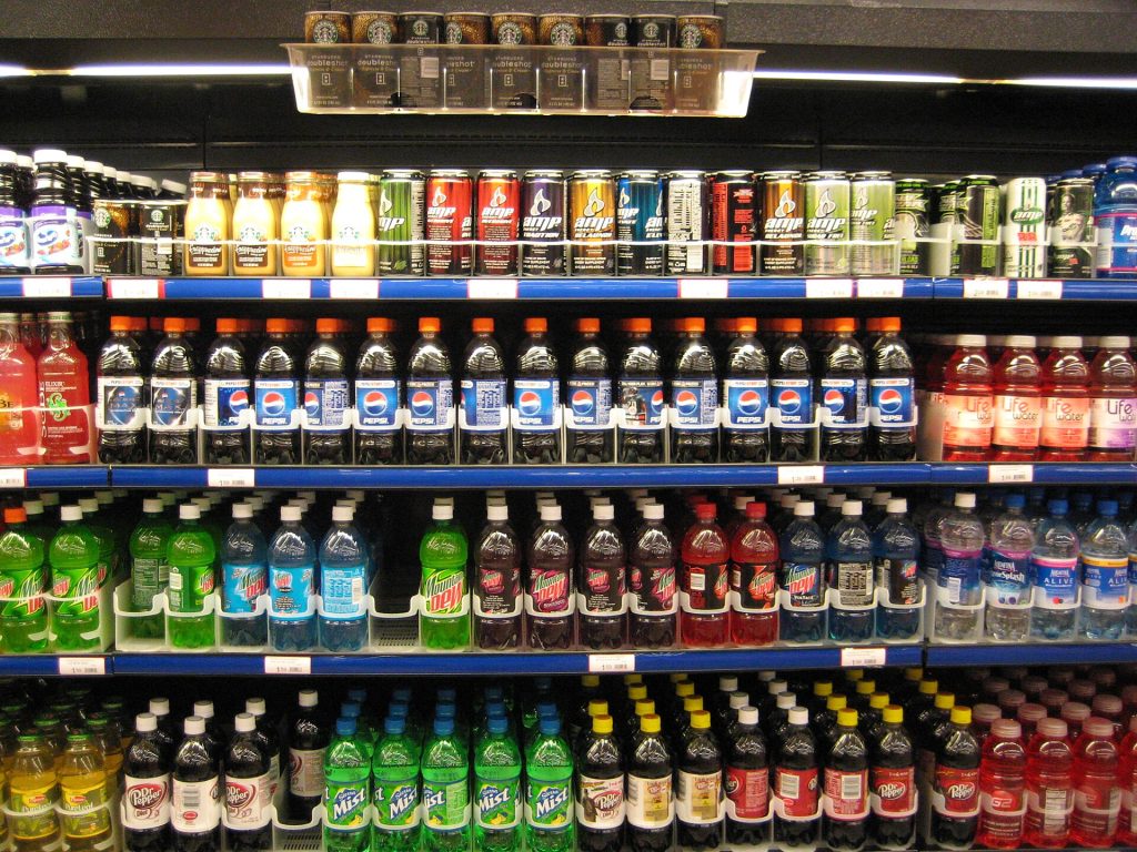 Supermarket shelves with packaged foods and nutrition labels